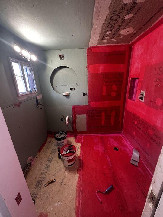 Cement board and waterproofing membrane in place.