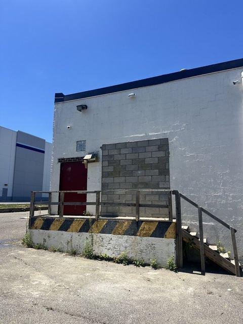 8-inch cinder block closure completed at a former loading opening