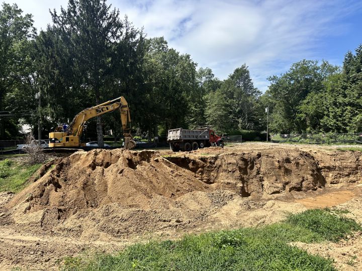 Excavator and spoil pile at the dig.