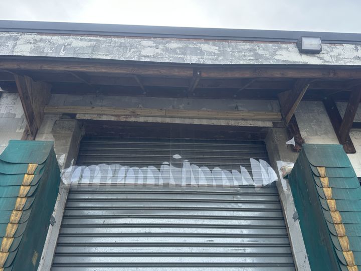The loading dock and overhead door before sealing.