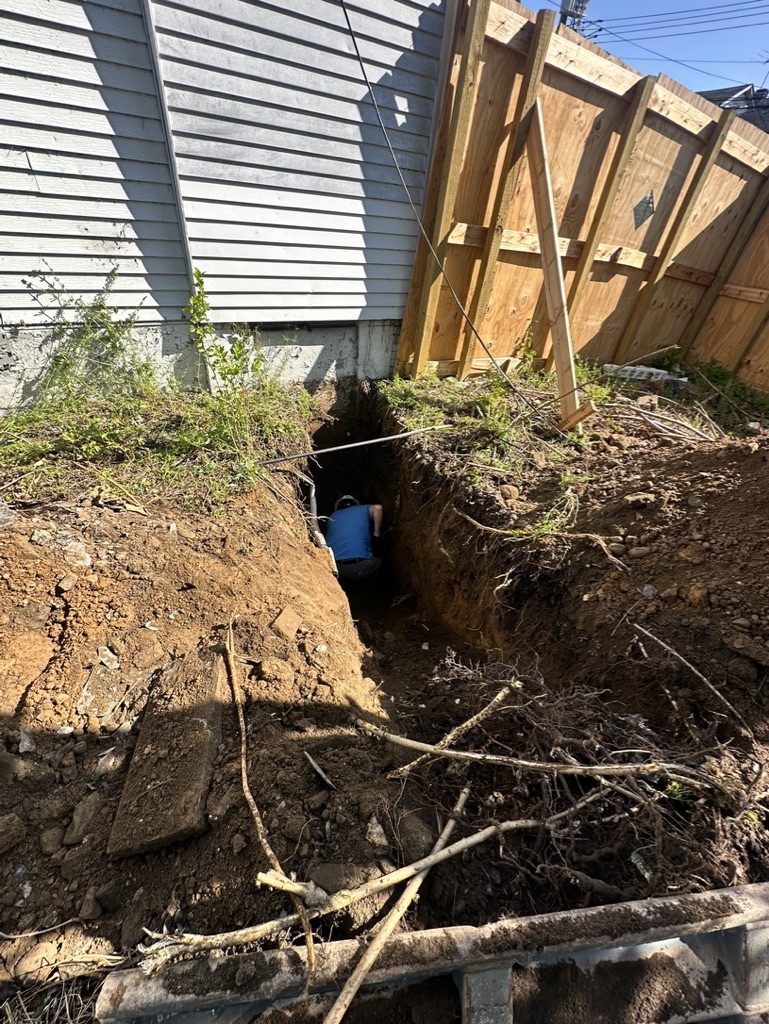 Test pit dug for the geotechnical investigation on the Bronx lot