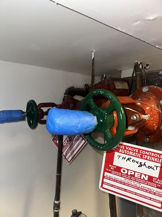 Valves taped and painted green for compliance.