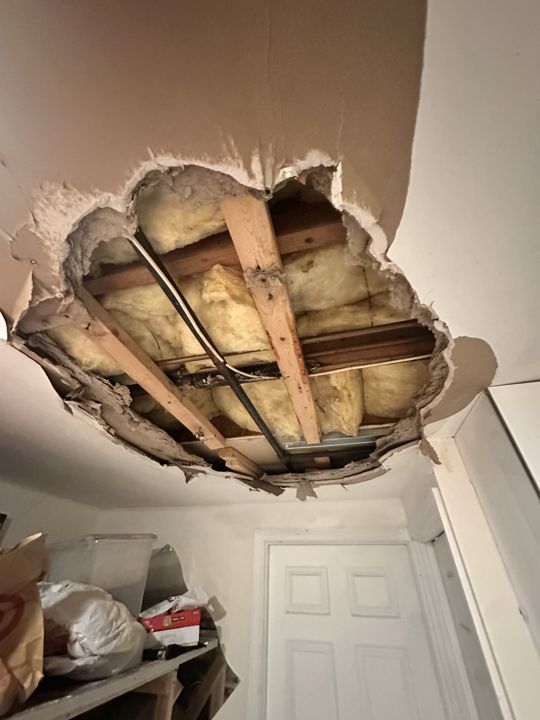 Ceiling opening prepared for repair.
