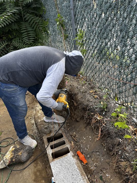 Block being laid on the new footing.