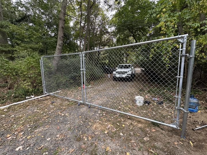 Construction fencing and gates securing the site.