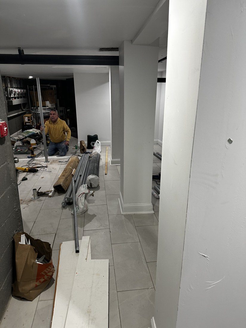 Galvanized framing and chain-link storage enclosure installation in a Brooklyn multifamily building