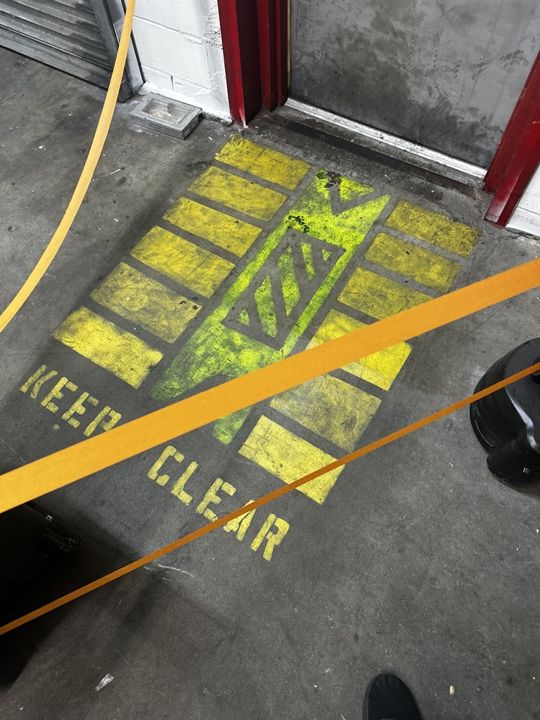 Keep-clear marking at an exit door.