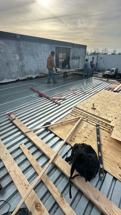 New metal decking installed before the membrane tie-in.